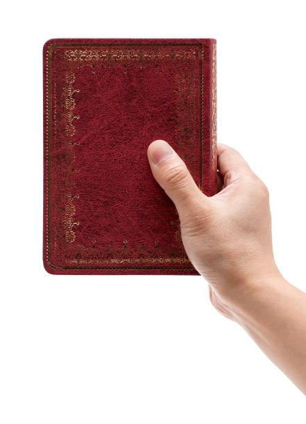 istock Holding a hardcover book isolated on white background 166182260