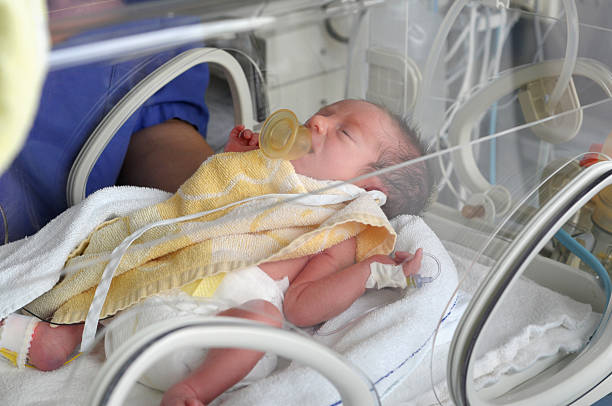 istock Newborn baby in incubator 166182515