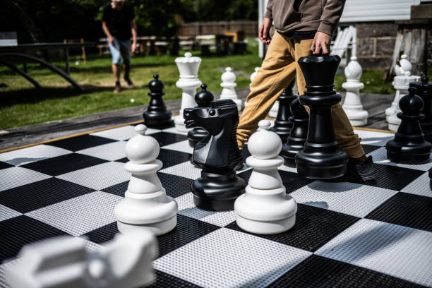 istock Pieces of a large garden chess set.. 1661829229