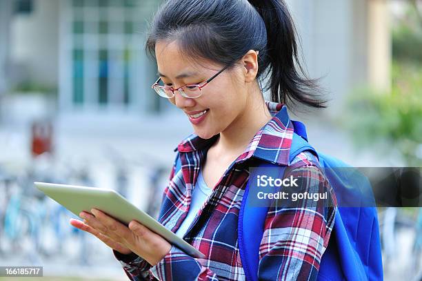 Asian Adult Student Use Tablet In Campus Stock Photo - Download Image Now - 25-29 Years, Adult, Adult Student