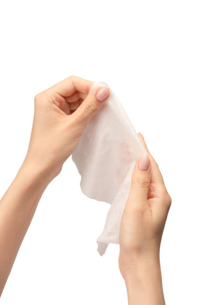 istock Wet wipe in a woman hand isolated on a white background. 1661857200