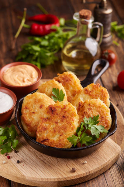 istock Hash browns. Pancakes from julienned potatoes. Vegetable patties. 1661858161