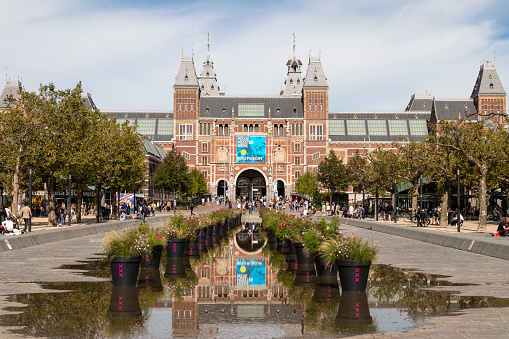 Amsterdam, the Netherlands - March 12, 2014: I amsterdam sign at Museumplein, Rijksmuseum in the back
