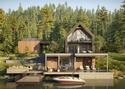 Computer generated image of a forest house on the lake with small wooden jetty. 3D render of a luxurious style forest house on the edge of a lake.