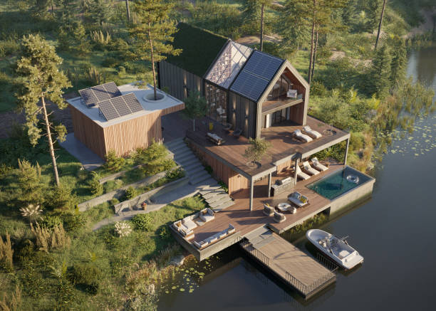 High angle view of a modern forest house on the lakeside with small boat deck