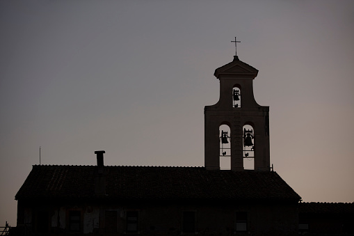 The church bell of a small church by lake of Bracciano photographed on an early winter morning