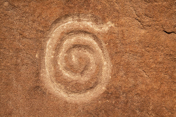 Image of a petroglyph spiral (snail) on the bank of the Amur River, below the village of Sikachi-Allian