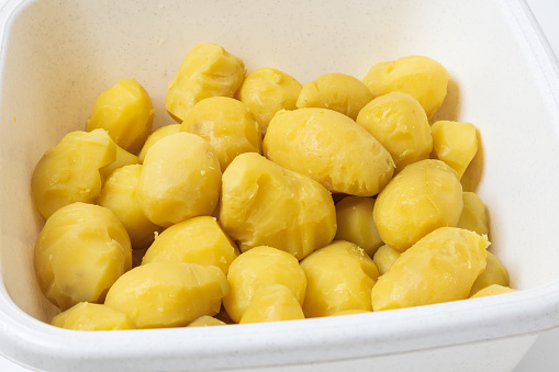Healthy food. Peeled boiled potatoes in a white bowl.