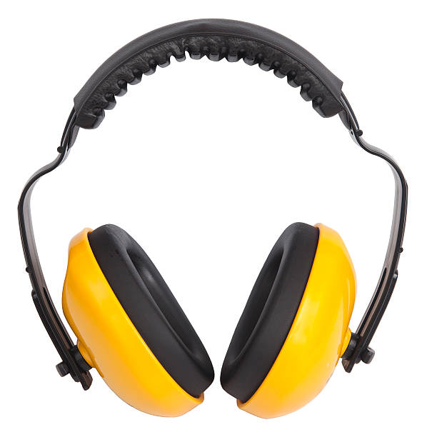 Close-up of cordless yellow ear muffs on white background Hearing protection ear muffs, with clipping paths ear protectors stock pictures, royalty-free photos & images