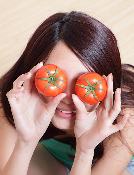 istock Tomato. funny girl showing tomatos 166188131