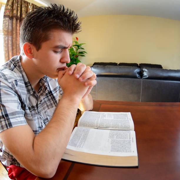 istock Latin Teenager Praying 166188497