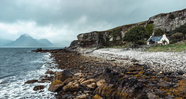 Elgol Beach Elgol beach on the southwest point of the Isle of Skye provides a stunning view over the cliffs, ocean and hills in the distance. elgol beach stock pictures, royalty-free photos & images