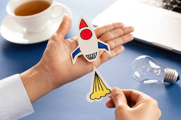istock Business Person with Startup Rocket 1661902919
