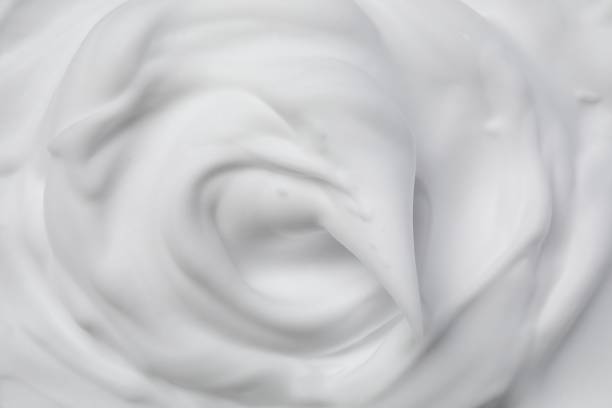 istock Texture of white shaving foam as background, top view 1661903445