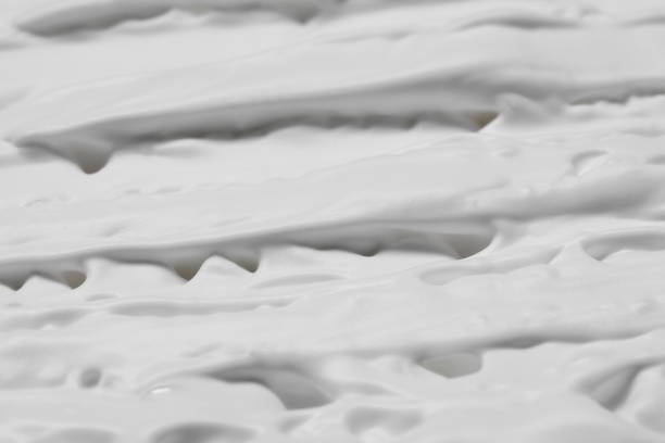 istock Texture of white shaving foam as background, top view 1661903450