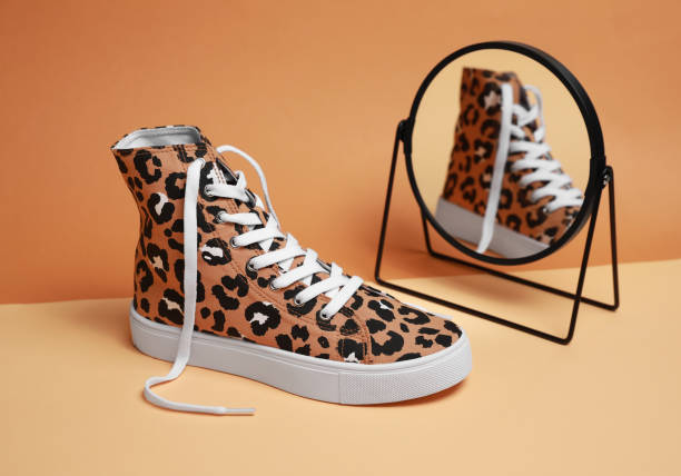 istock One classic old school sneaker and mirror on color background 1661904533