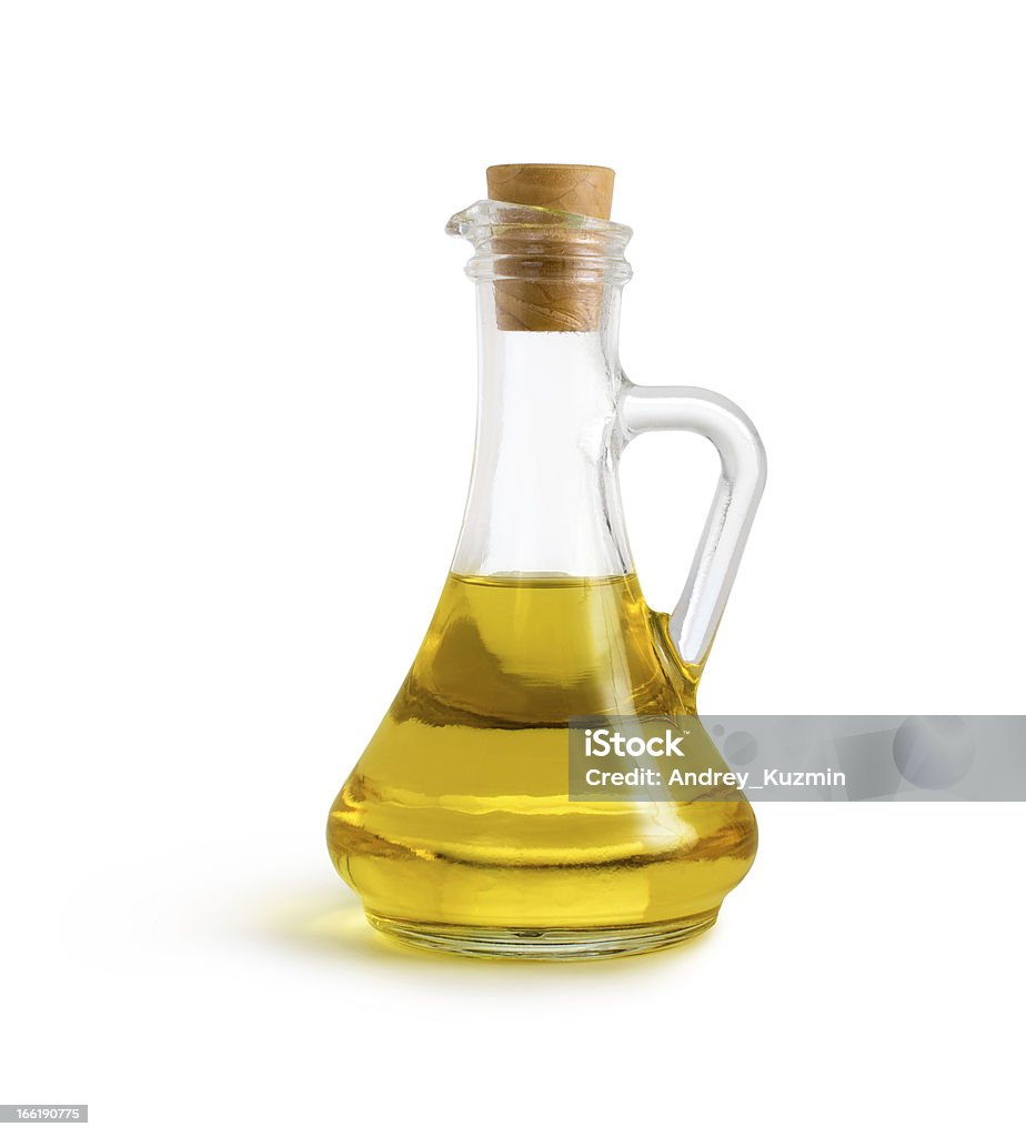 olive vegetable oil in glass pitcher isolated olive vegetable oil in glass pitcher isolated on white with clipping path included Bottle Stock Photo
