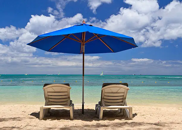 Beach chairs on tropical beach in Mauritius