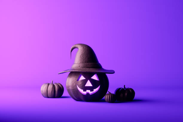 istock Halloween pumpkins on purple background 1661926697