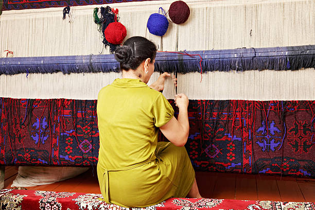 Carpet weaver stock photo