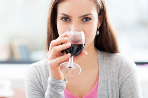 Woman having glass of wine