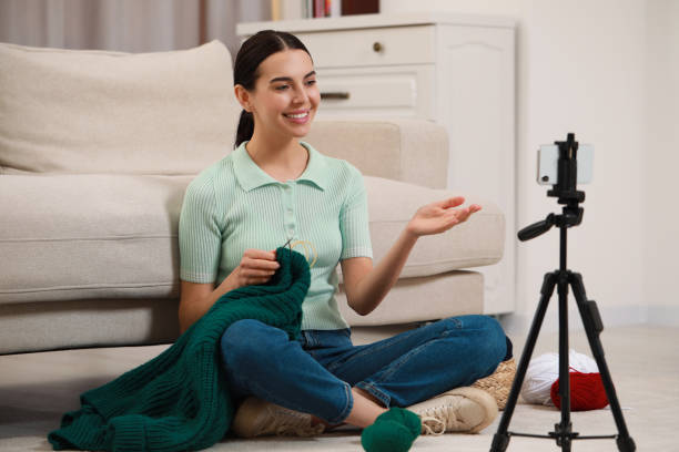 istock Teacher conducting online knitting course at home. Time for hobby 1661955908