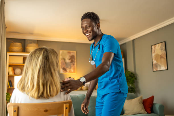 istock Men Caregiver in Uniform Hugging Elderly Woman During a Home Visit. 1661977776