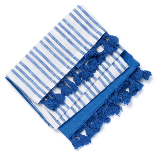istock Folded white blue linen napkin with pom pom on a white isolated background, top view 1661981489