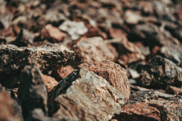 istock Abstract background texture Small brown stones close-up 1662020115