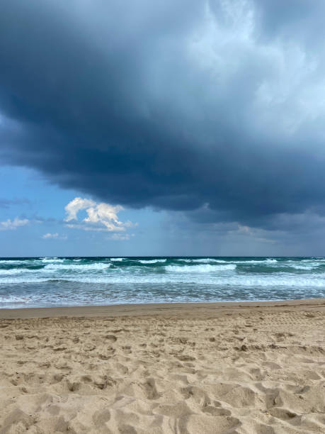 seascape image of waves on sea over stormy sky