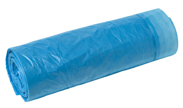 istock Blue plastic trash bags with strings on white background, close up 1662031953
