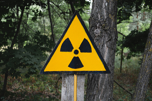 Orange symbol of radioactivity in the Chernobyl exclusion zone in Ukraine. Radiation sign