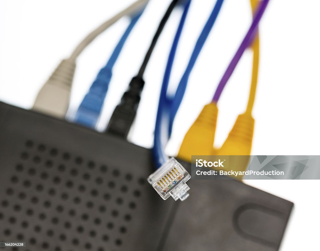 Cat5 cables and router for cyberdefence concept Close macro focus on internet lan cat5 cables as concept for cyberwarfare Cable Stock Photo