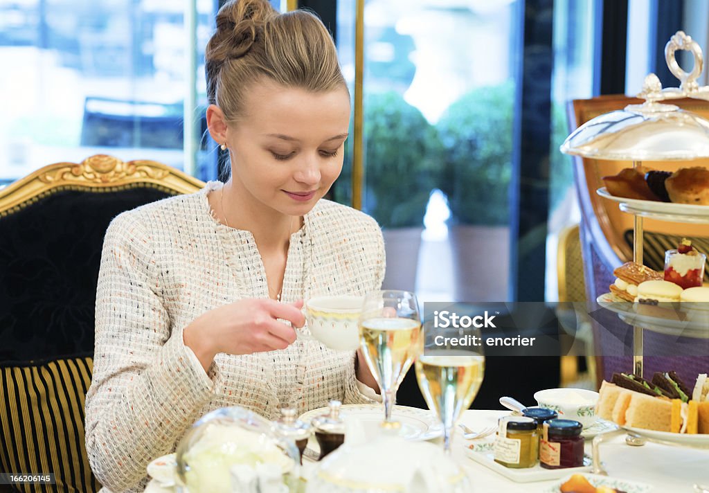 Young beautiful lady at high tea ceremony Afternoon Tea Stock Photo