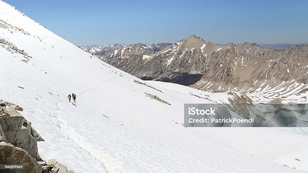 Sierra Nevada Adventure Sierra Nevada Adventure - Hikers descending from a Mountain Pass in Kings Canyon National Park. Kings Canyon National Park - California Stock Photo