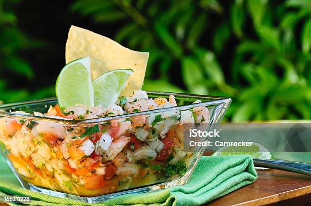 Ceviche In A Bowl With Lime On A Wooden Table Stock Photo - Download Image Now - Seviche, Shrimp - Seafood, Lime
