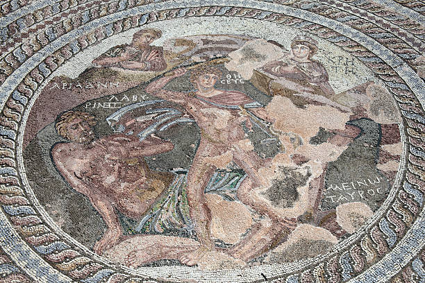 Roman Mosaic Of Theseus And the Minotaur Paphos, Cyprus Roman mosaic of Theseus and the Minotaur at the Villa of Theseus, Paphos Archaeological Park, Cyprus minotaur photos stock pictures, royalty-free photos & images