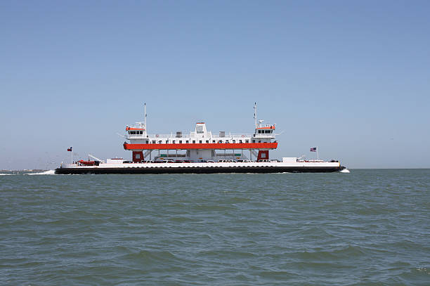 The Galveston-Port Bolivar ferry is the bridge between two segments of State Highway 87 between Bolivar and Galveston Texas.  Taken on a clear crisp spring day.
