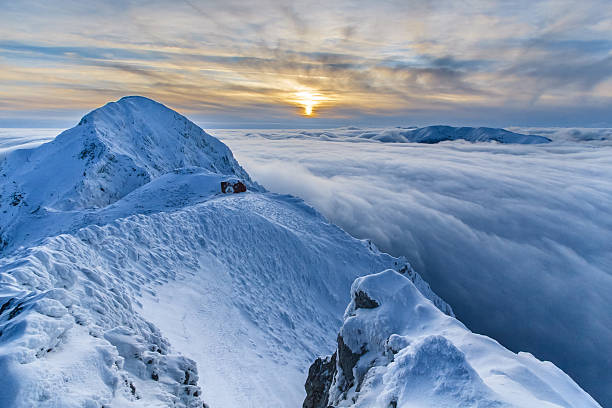 istock sunset over the mountains and clouds in winter 166212206