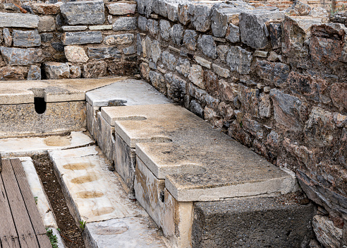 Ruins of the Public Latrine in the ancient Greek city of Ephesus, Selcuk, Izmir Province, Turkey