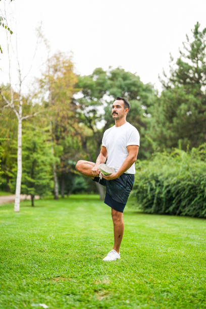istock warming up in the park man making moves 1662186421