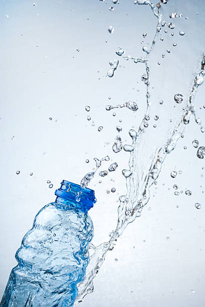 istock Water splash out of glass 166219625