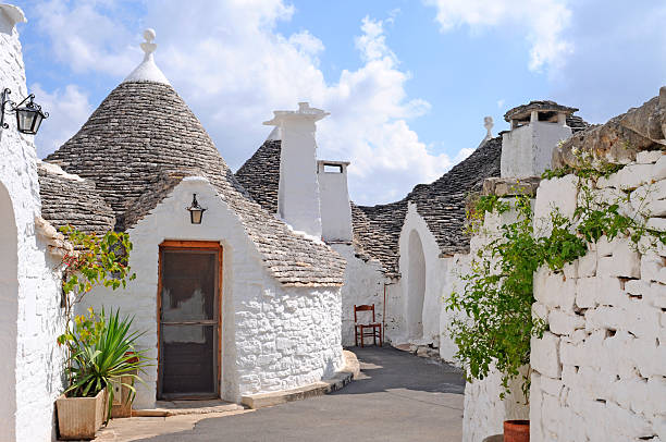Trulli houses in Alberobello, Italy Typical trulli houses with conical roof in Alberobello, Italy trulli house photos stock pictures, royalty-free photos & images
