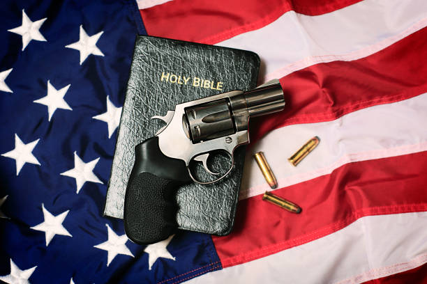 istock Gun and Bible on American Flag 166219986