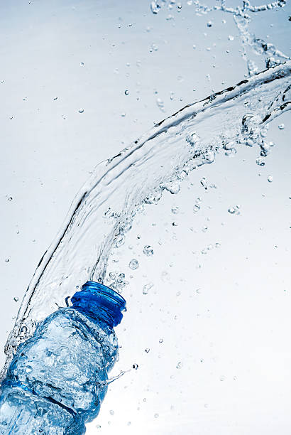 istock Water splash out of glass 166221473