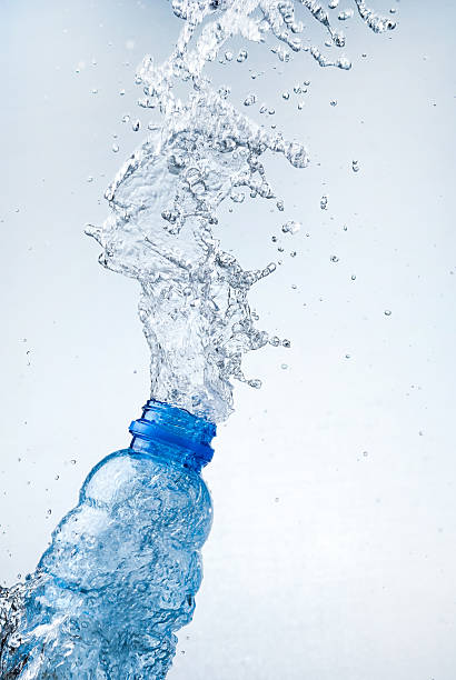 istock Water splash out of glass 166221483