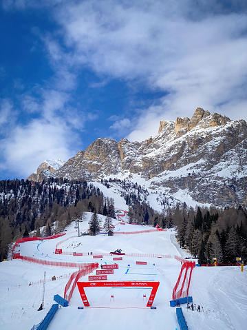 Cortina d'Ampezzo, Italy - January 28, 2023: Finish at Tofana ski racing slope against blue sky with clouds