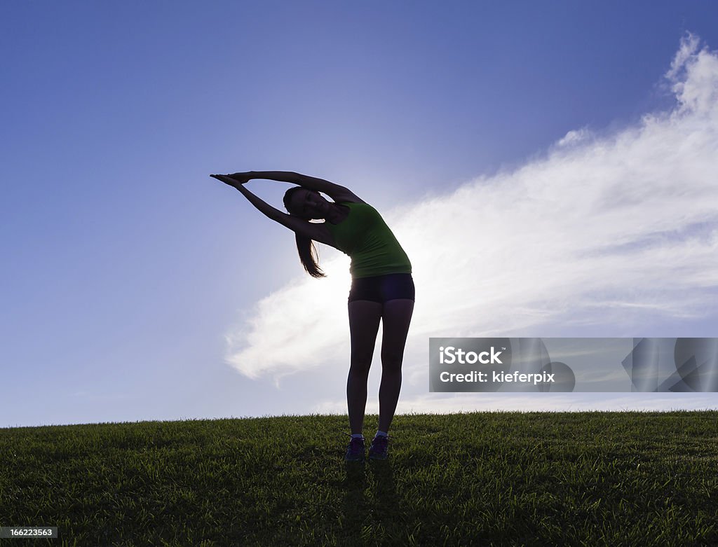 Yoga silhouette Silhouette of woman practicing yoga before sunset. (please see some of my similar Silhouettes below)  Adult Stock Photo