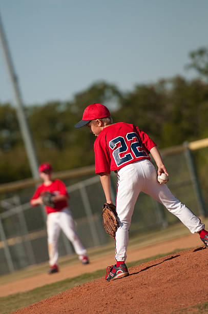 istock Little league baseball pitcher looking at batter. 166224167
