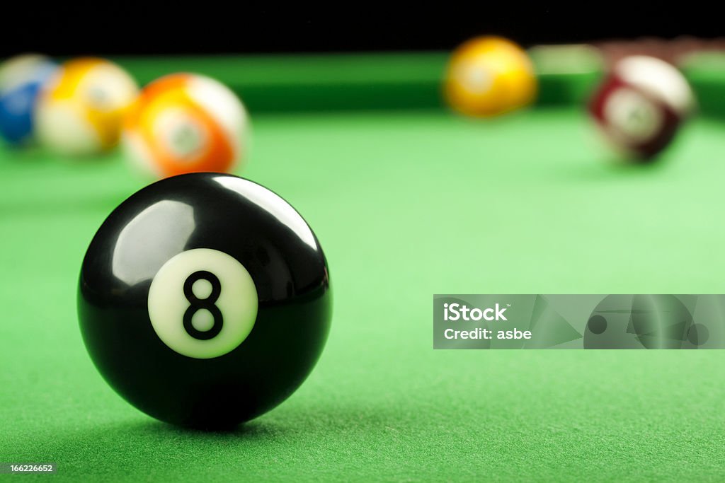 Eight Ball on Pool Table Pool game close-up. Selective focus on black eight ball Number 8 Stock Photo
